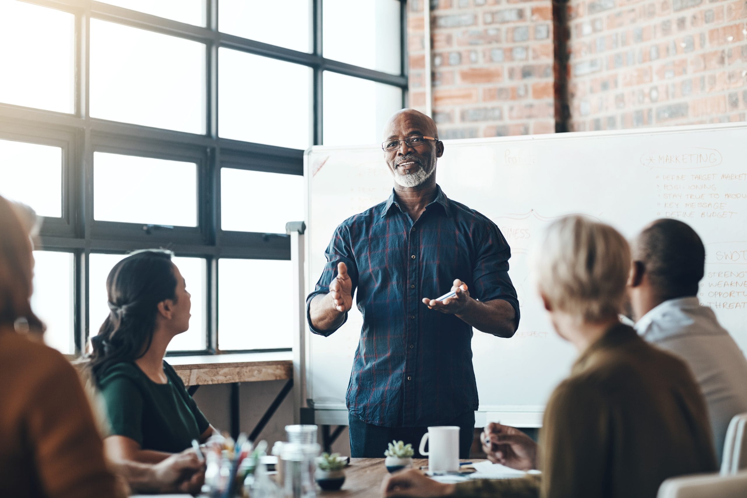 Senior professional leads a training